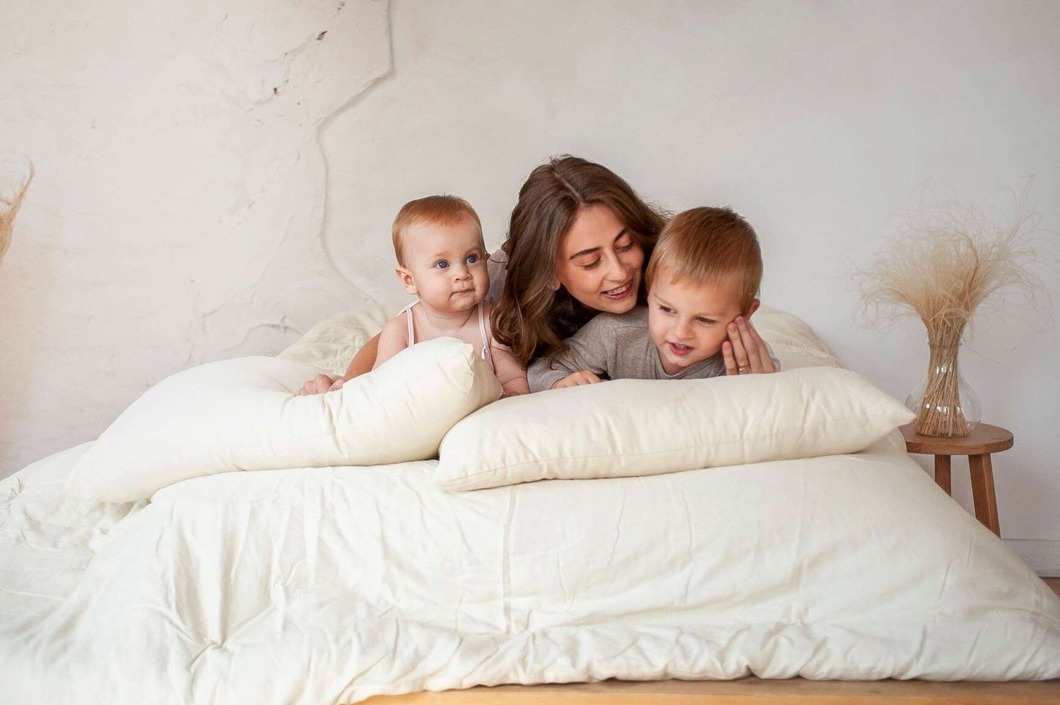Woman and two kids on organic bedding