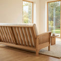 Japandi Living Rooms: How to Style a Minimalist Wood Couch (That Doubles as a Bed)