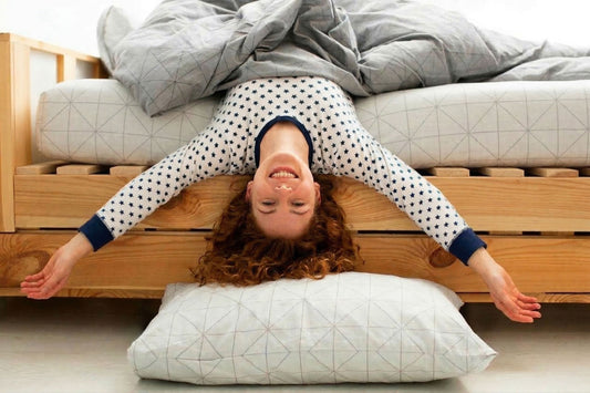 Girl Hanging off a Bed