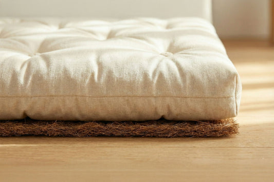Mattress resting on a coconut coir pad