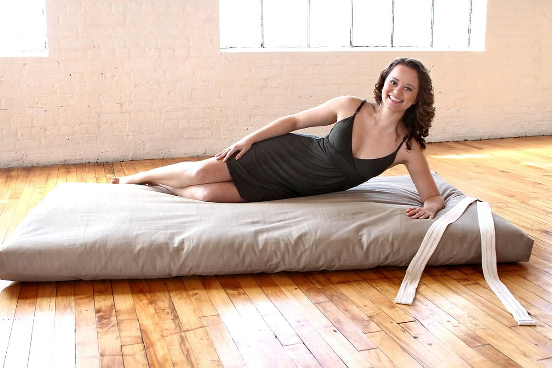Roll-away floor mattress folded for storage