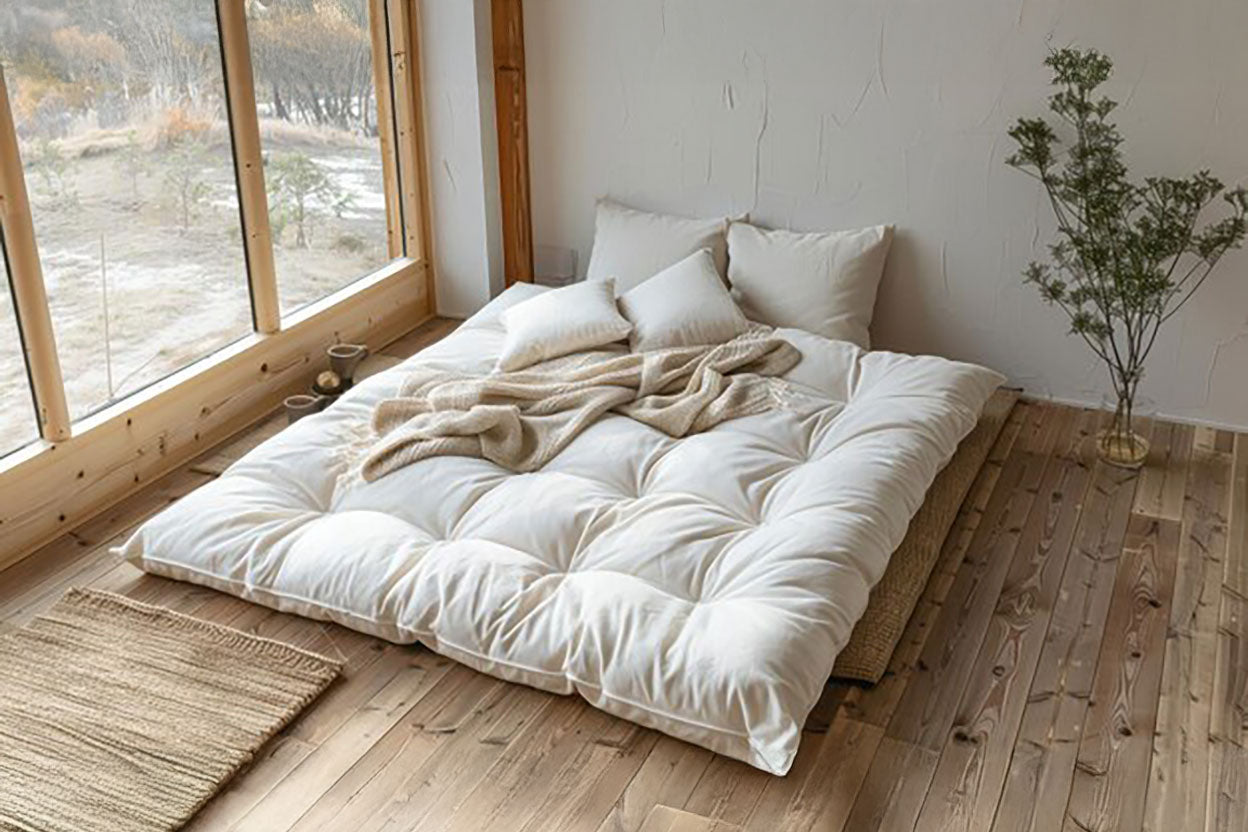 Tufted mattress on a wooden floor